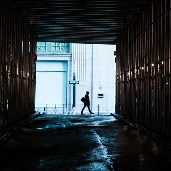 Person walking through alley