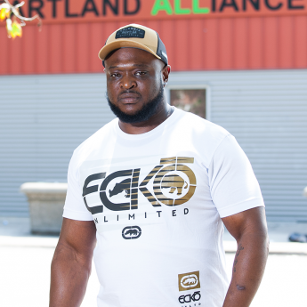 Sylvester, a beneficiary of the READI Chicago initiative, stands outside a Heartland Alliance building in Chicago