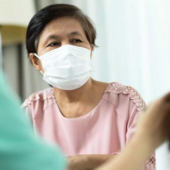 Doctor communicates with a patient about the COVID-19 vaccine