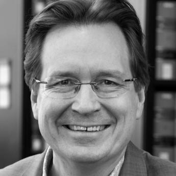 A black and white photo of Prof. Mark Templeton