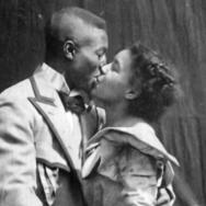 Two people embracing in a kiss