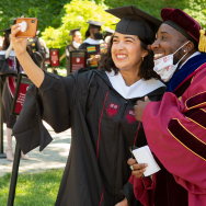 Two Crown Family graduates pose for a selfie