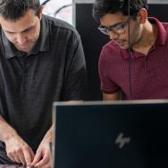 Kenwood Academy teacher Joseph Blake with Shankar Menon, PME graduate student